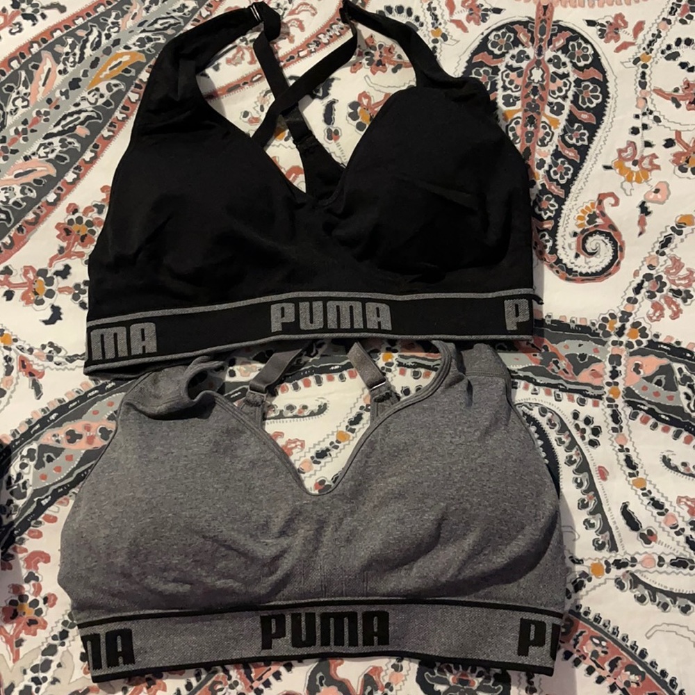 Two Puma sports bras. One black one gray size lg